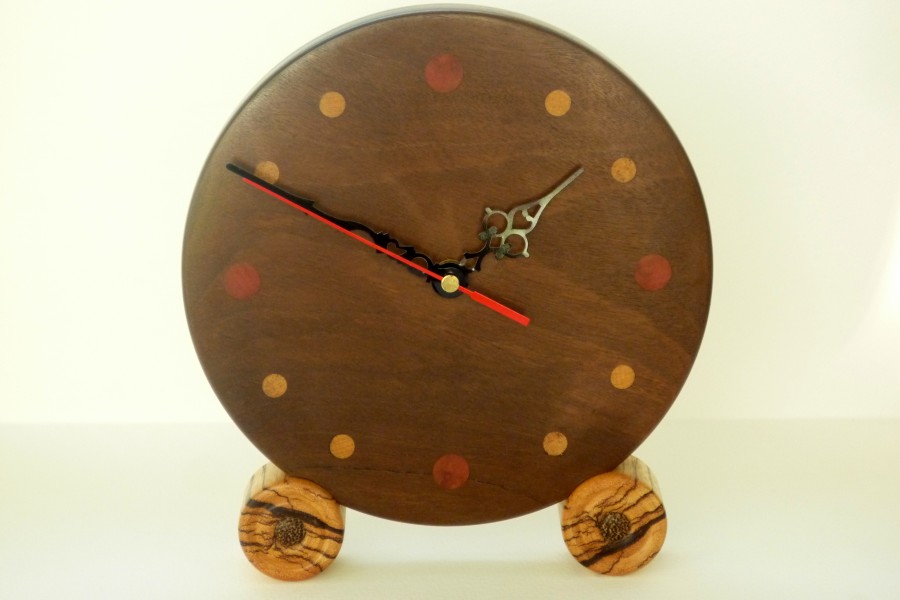 Handmade wooden clock in Afra wood with numerals in other woods