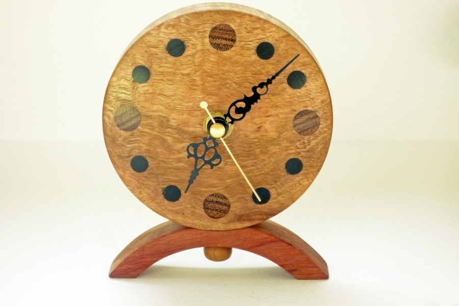 Handmade wooden clock in corrugata wood with numerals in various woods