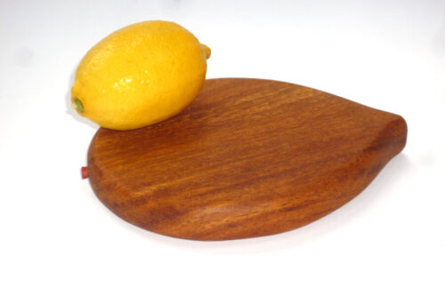 Lemon shaped wooden mini chopping board in Mango wood with pip detail