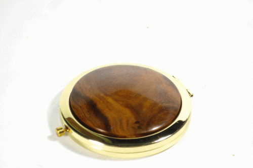 Compact with Gold finish surround old lignum vitae wooden feature top
